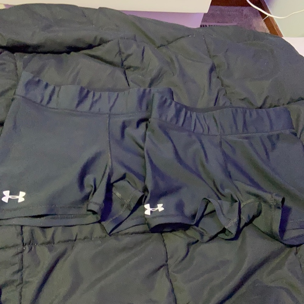 These are 2 pair of black under armor spandex size medium